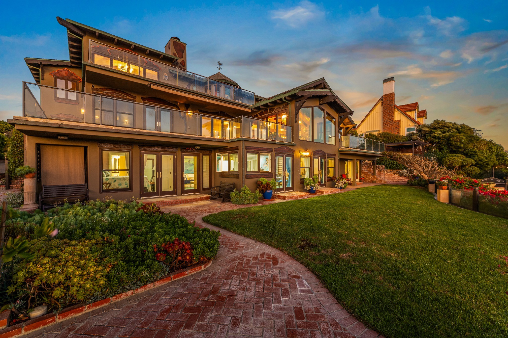 Garden-facing building exterior at twilight