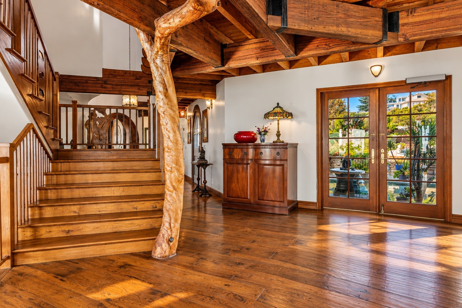 Entry foyer with sculptural timber staircase